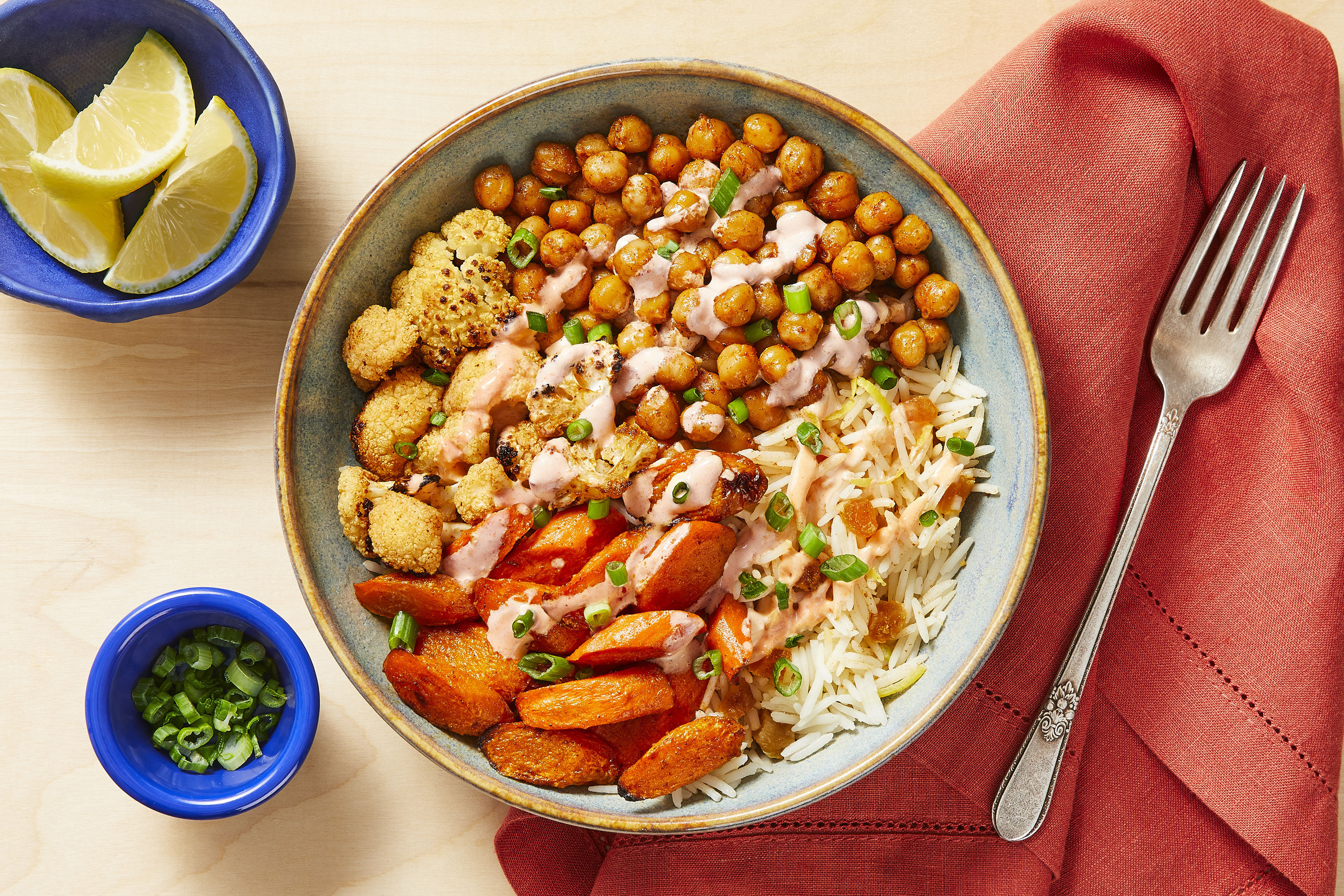 Cauliflower & Cinnamon Chickpeas over Apricot Rice with Hot Sauce Crema