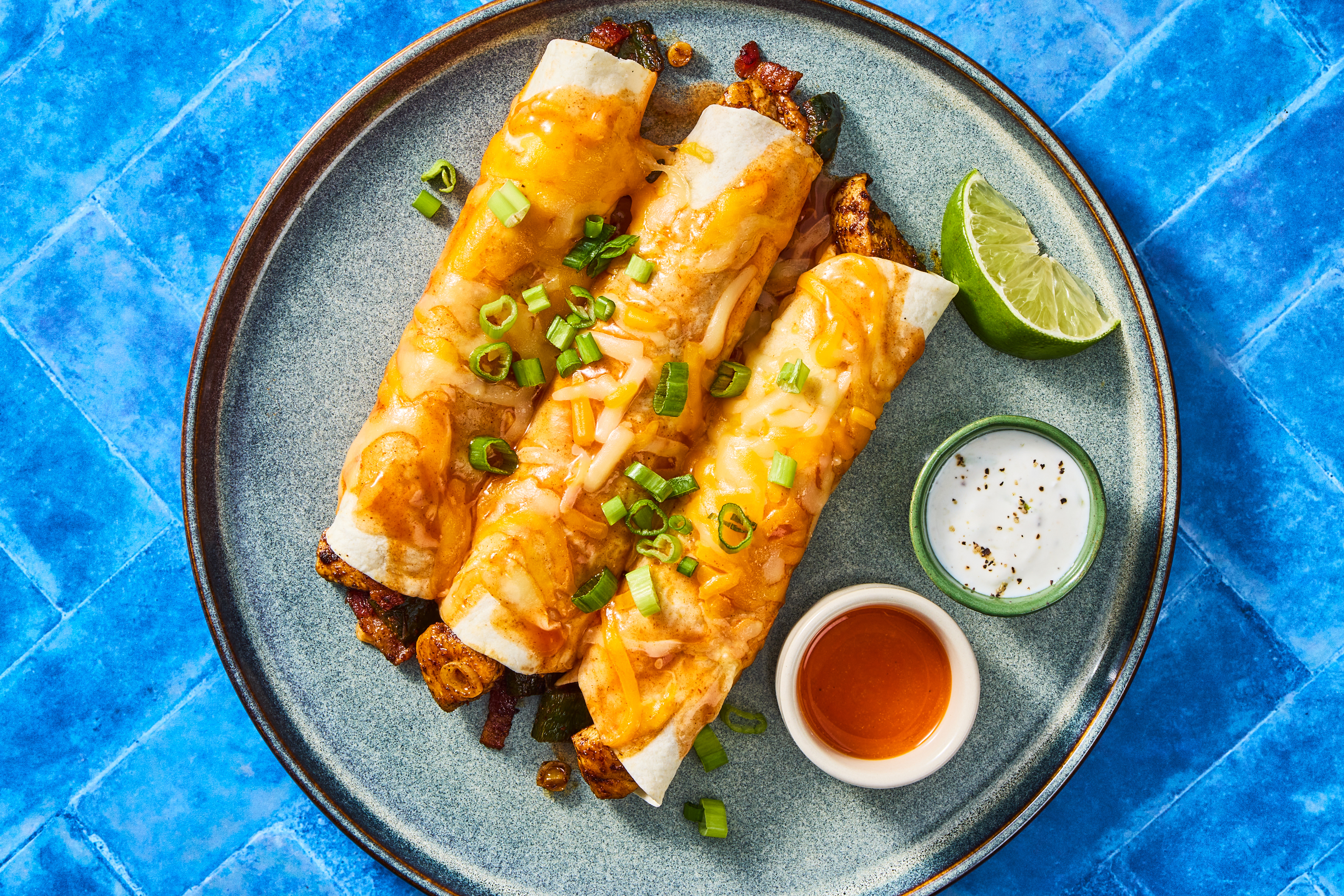 Chicken, Pepper & Bacon Enchiladas: Lime Crema & Scallions